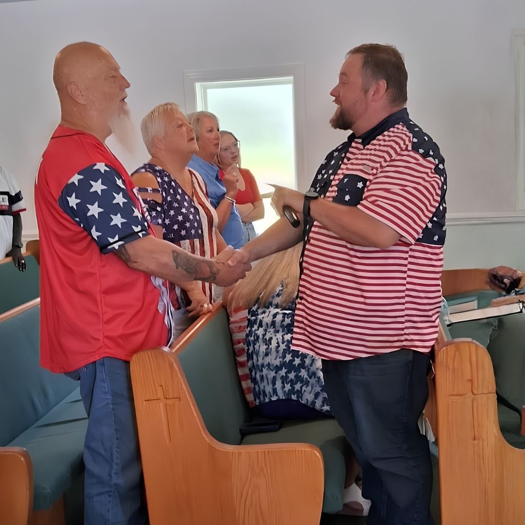 Members greeting one another in the sanctuary